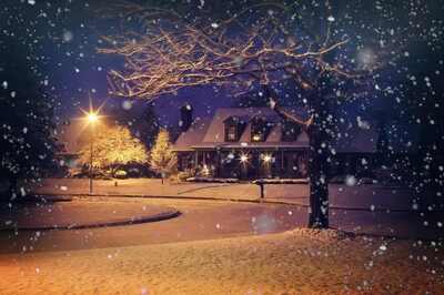 Image of a house on a street during a winter storm